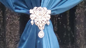 Pipe & Drape - Silver Drape Jewelry rental Fresno-Armona, CA